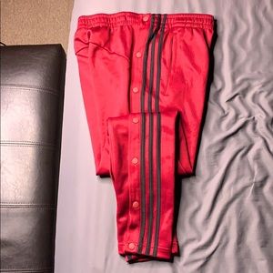 Adidas trainer pants side button snaps legs.